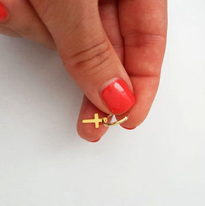 small cross earrings on gold